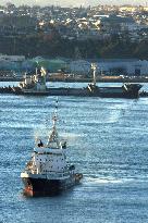 Stranded N. Korean freighter towed to open waters